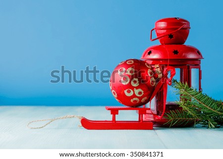 Winter symbol. Red lantern and green pine on aquamarine background