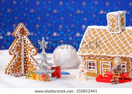 Christmas card with gingerbread house and tree with decorations