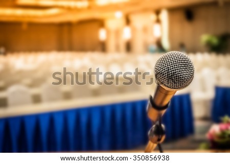 Microphone in the conference room for talker, the art or practice of formal  speech in public with defocused background, selective focus on microphone  Royalty-Free Stock Photo #350856938