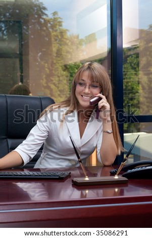 Beautiful business woman talking on the phone