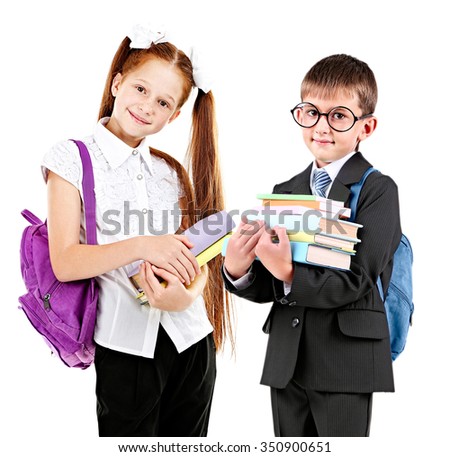 Cute school girl and schoolboy, isolated on white