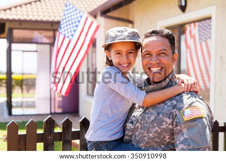 portrait of us army soldier and little daughter outside their home Royalty-Free Stock Photo #350910998