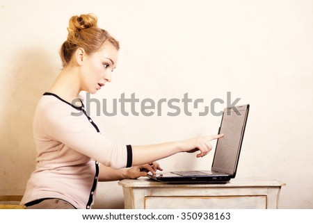 Technology internet modern lifestyle. Young businesswoman woman student girl working on computer laptop touching screen. Business at home.