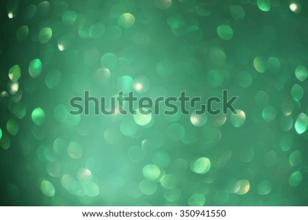 Glitter bokeh abstract green background.