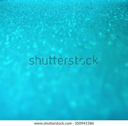 Glitter bokeh abstract blue background.