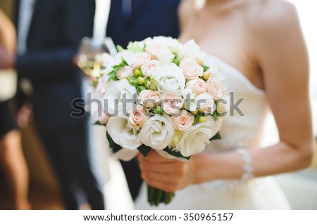 nice wedding bouquet in bride's hand Royalty-Free Stock Photo #350965157