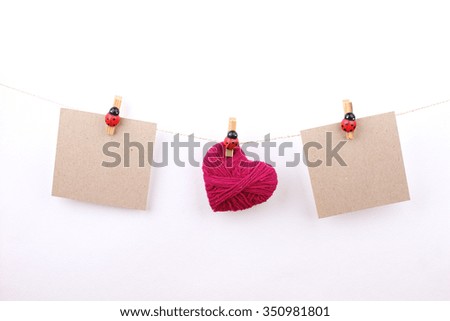 Happy Mothers Day card for writing, hanging from pegs on a line against a 
white background.