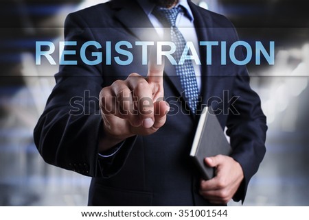 Businessman pressing button on touch screen interface and select registration. 