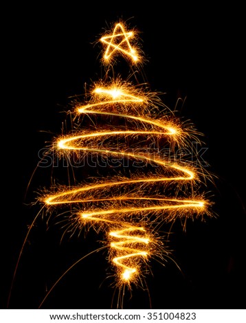Christmas tree made with sparkler on a black background