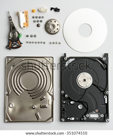Disassembled laptop hard drive on a white background