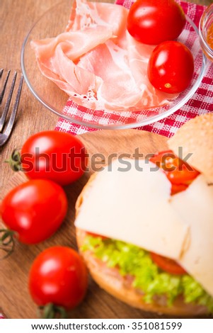 sandwich with ham,tomatoes and fresh lettuce in studio