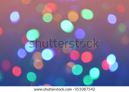 Bokeh lights background. Abstract bokeh circles background in retro style. Holiday defocused lights. Photo can be used for web design, surface textures, wallpapers and other.