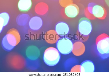Bokeh lights background. Abstract bokeh circles background in retro style. Holiday defocused lights. Photo can be used for web design, surface textures, wallpapers and other.