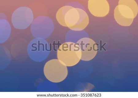 Bokeh lights background. Defocused yellow circles on blue and pink background. Photo can be used for web design, surface textures, wallpapers, printed products and other.
