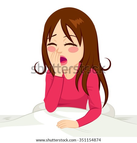 Beautiful brunette girl waking up and yawning sitting on bed