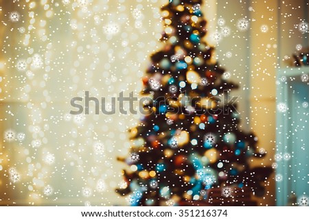 Defocused background Living room with christmas tree, stars and snow