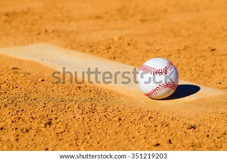 Baseball or Softball on Dirt Mound 
