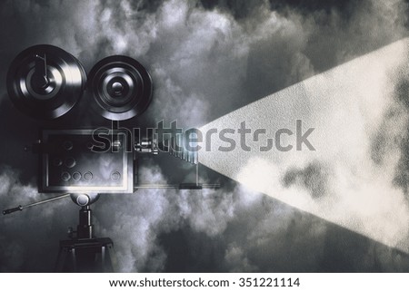 Vintage camera making a film in the dark room with clouds