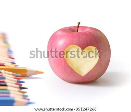 School supplies and a apple.