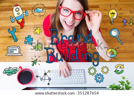 Brand Building concept with young woman wearing red glasses in her home office