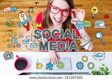 Social Media concept with young woman wearing red glasses in her home office
