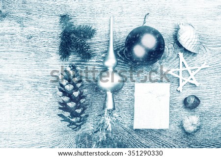 Christmas fir tree with cones and christmas tree decoration on a wooden background. Template for banner or bavkground, or image for a blog.