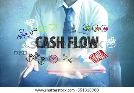 businessman holding a tablet computer with CASHFLOW text ,business concept 