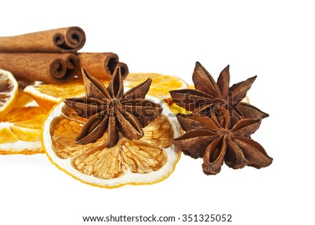 Christmas decoration - orange, cinnamon and anise on a white background