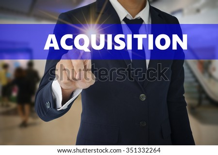 Businessman touching ACQUISTION  sign on virtual screen ,business concept ,business idea