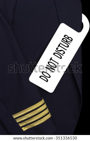 Airline Captain uniform with a tag. DO NOT DISTURB