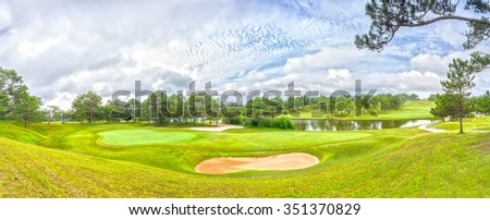 Da lat panoramic golf course with grass, pine forest, interwoven, far away from the lakes create picture wearing to greet a new day in the highlands of Dalat, Vietnam.