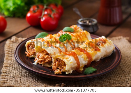 Meat cannelloni sauce bechamel  Royalty-Free Stock Photo #351377903