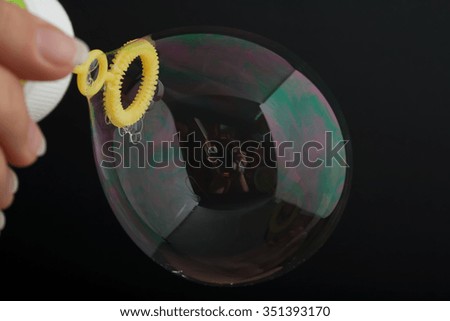 Girl inflates the bubble