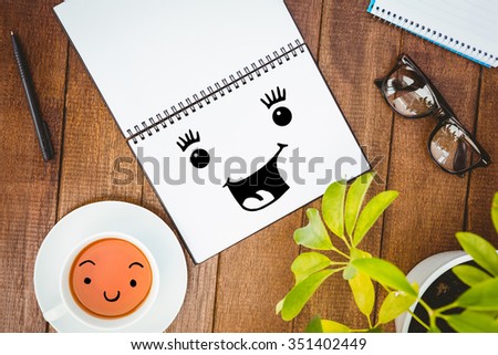 Smiling face against close up view of business stuff