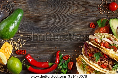 Fresh delicious mexican tacos and food ingredients.