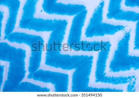 zigzag tie dyed pattern on cotton fabric for background.
