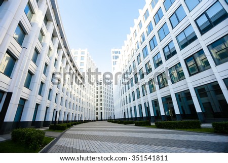 white building with blue windows on the blue sky Royalty-Free Stock Photo #351541811