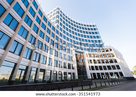 white building with blue windows on the blue sky Royalty-Free Stock Photo #351541973