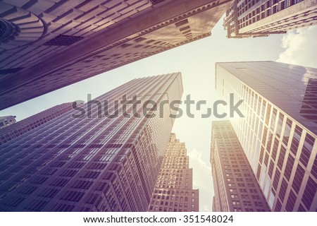 Vintage stylized photo of skyscrapers in Manhattan at sunset, New York City, USA. Royalty-Free Stock Photo #351548024
