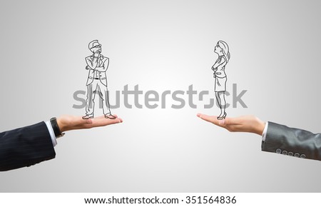 Drawn businesspeople in human palms on gray background