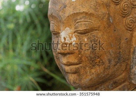 buddhist statue in nature - garden decoration