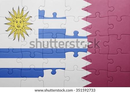 puzzle with the national flag of uruguay and qatar . concept
