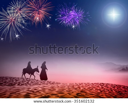 Nativity Christmas concept: Silhouette Mary, Joseph and baby Jesus with a donkey on night fireworks background