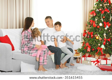 Christmas family portrait in home holiday living room, at christmas morning