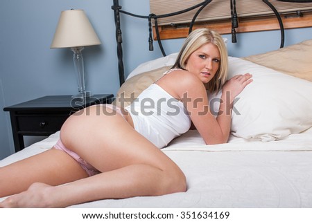 Young woman laying in bed