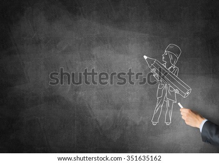 Male hand drawing with chalk doctor on blackboard