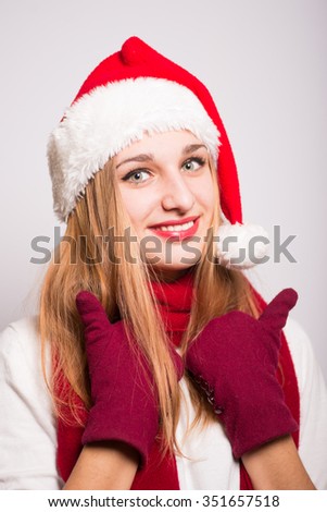 Christmas girl happy pleasantly surprised. Santa hat isolated portrait of a woman.