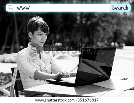 Young business woman with laptop working outdoors