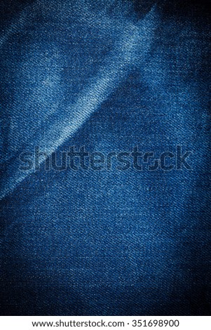 Vintage Blue torn denim jeans texture.
