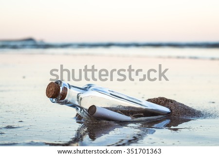 Message in a bottle with beach Royalty-Free Stock Photo #351701363